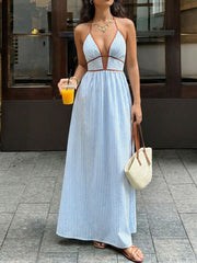 Blue striped maxi dress with halter neckline and brown trim, deep v-cut.