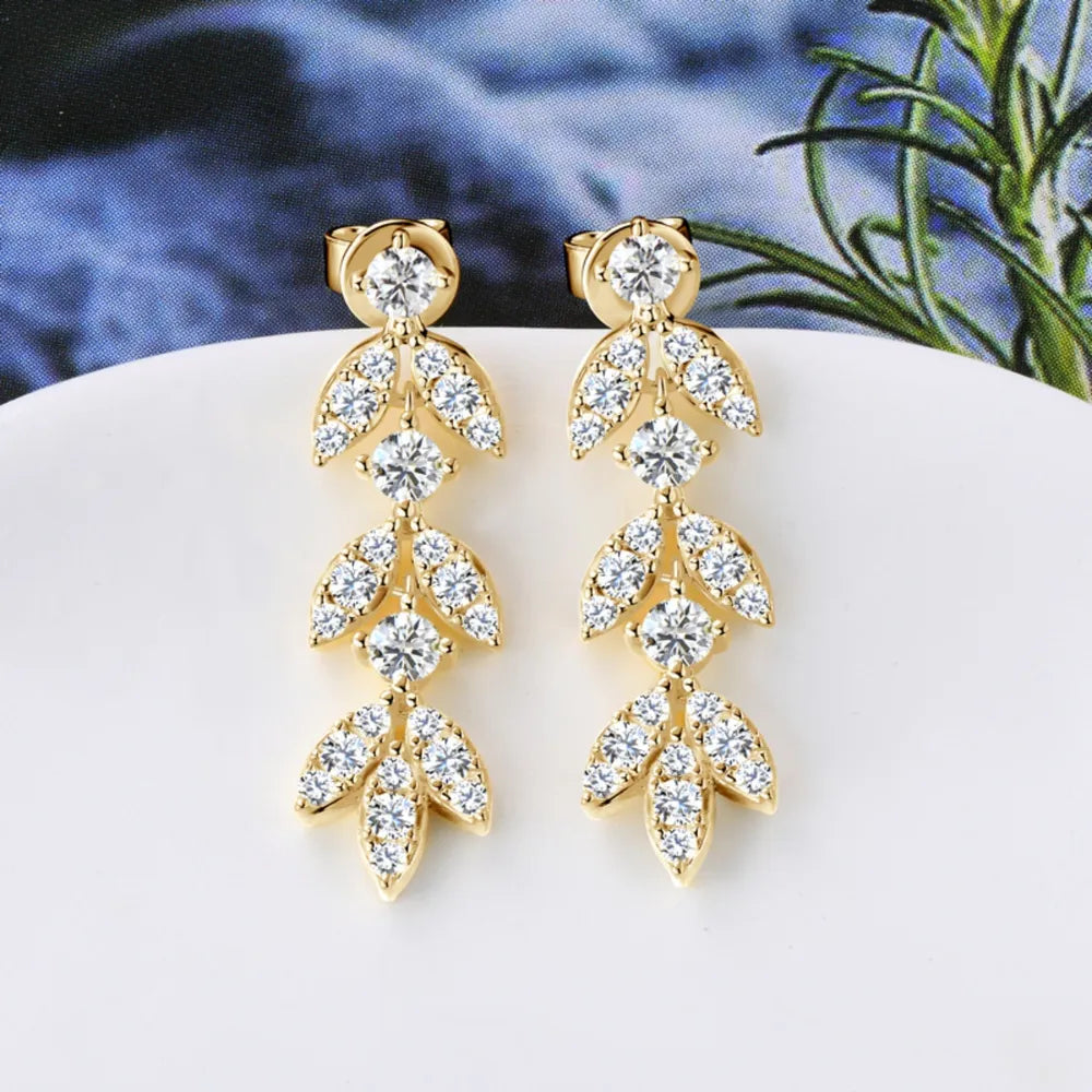 Gold cubic zirconia botanical drop earrings with leaf design