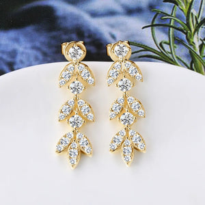 Gold cubic zirconia botanical drop earrings with leaf design