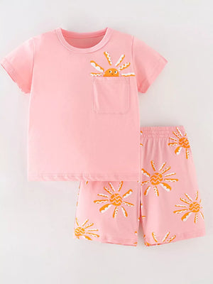 Pink cotton toddler top and shorts set with sun print and pocket detail