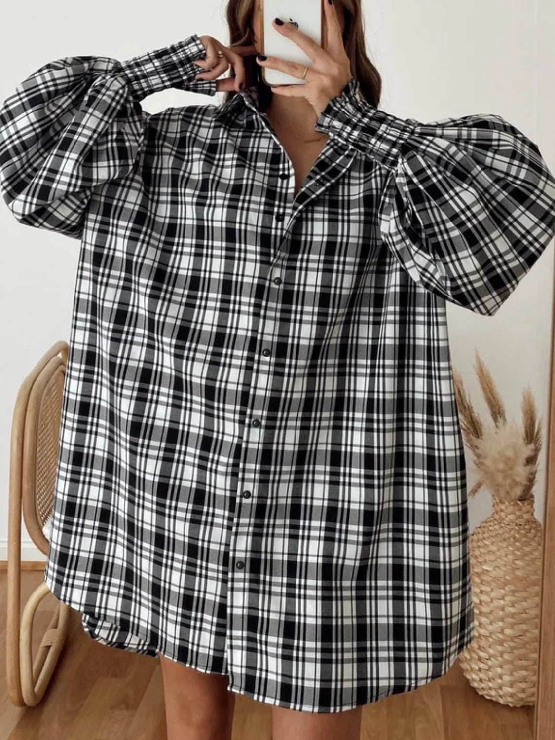 Black and white plaid oversized shirt with balloon sleeves and button front.