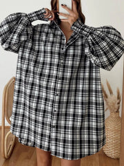 Black and white plaid oversized shirt with balloon sleeves and button front.
