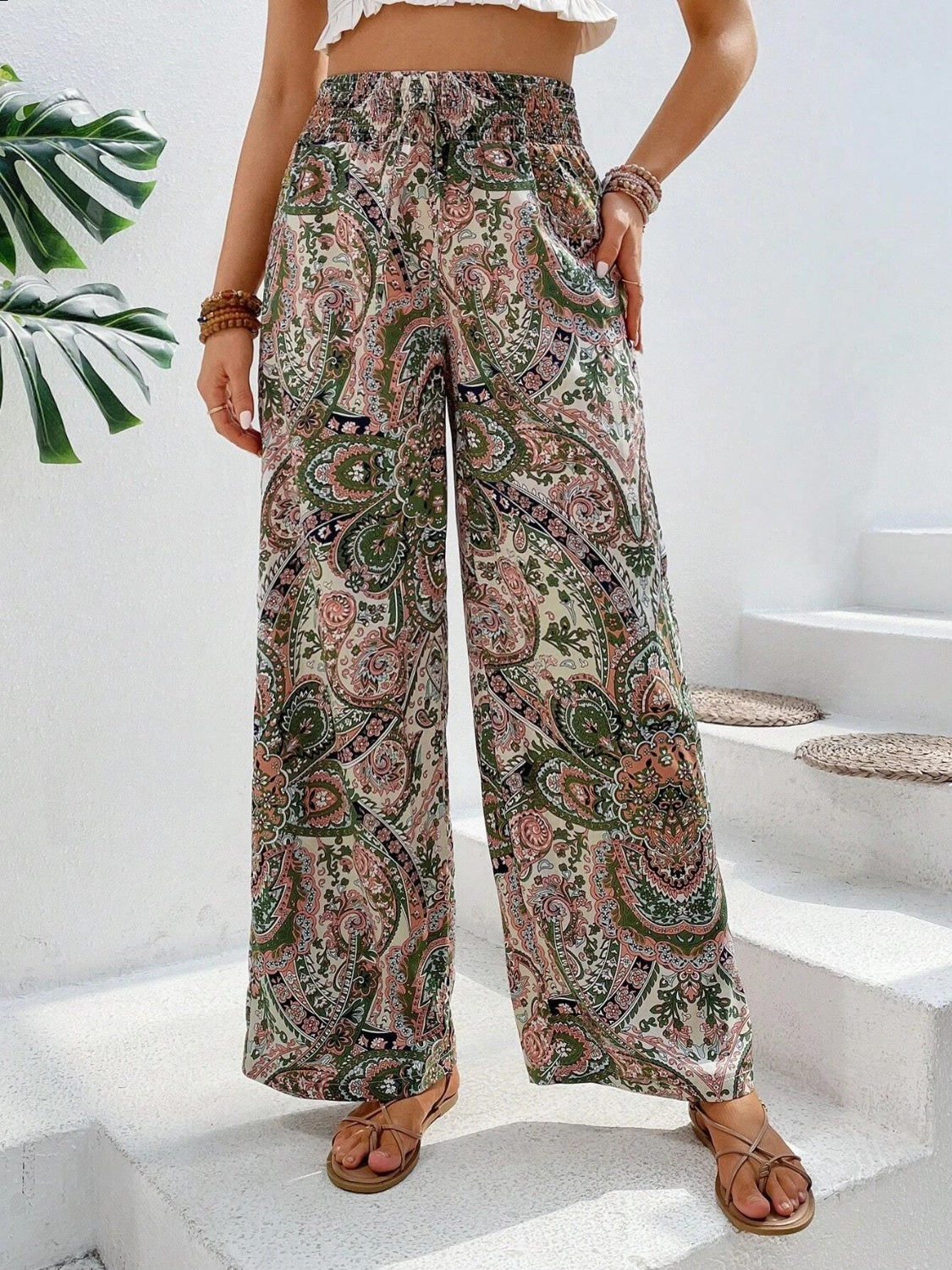 Paisley palazzo trousers in multicolor with a drawstring waist and wide legs.