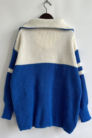Ribbed knit quarter-zip sweater in royal blue and white with a wide collar.