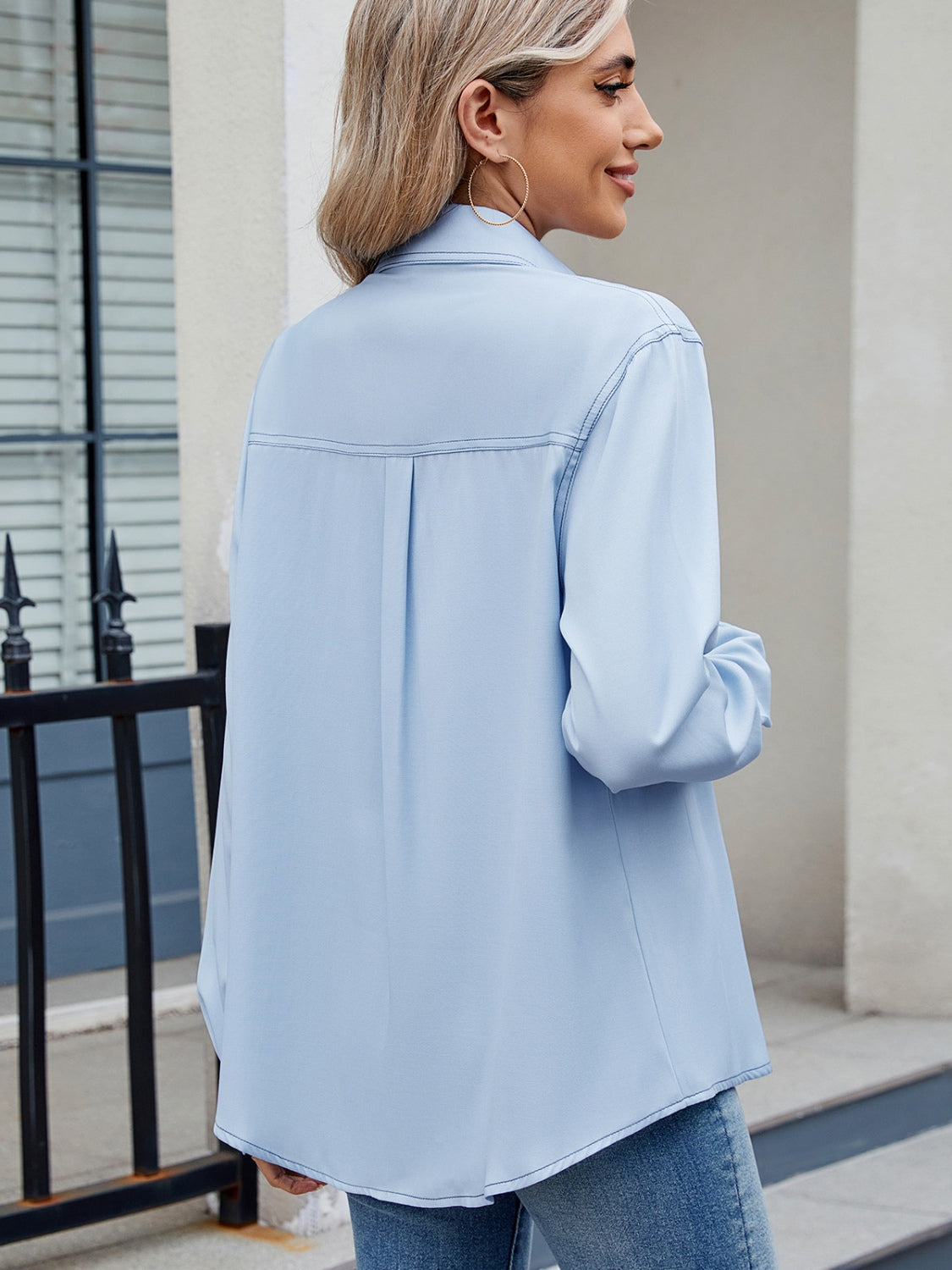 Light blue utility crepe shirt with contrast stitching and back pleat detail.