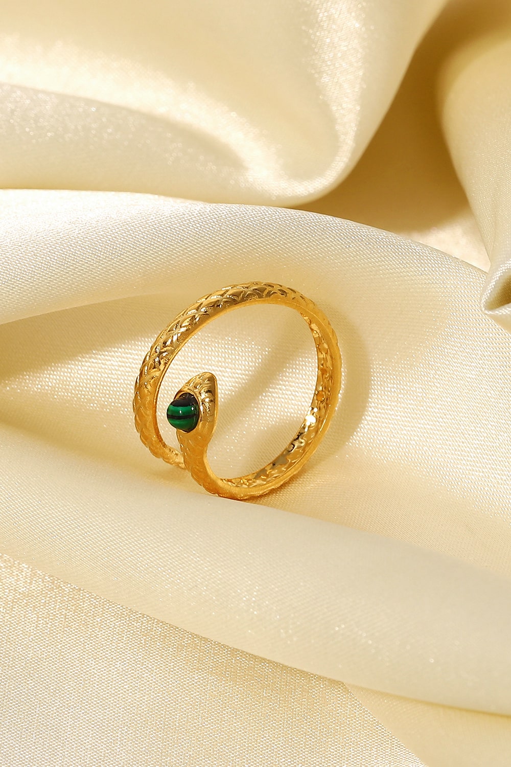 Gold serpentine ring with malachite head and textured band