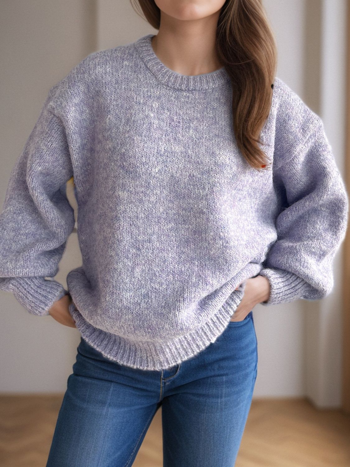 Lavender oversized crewneck sweater with textured knit and ribbed cuffs.