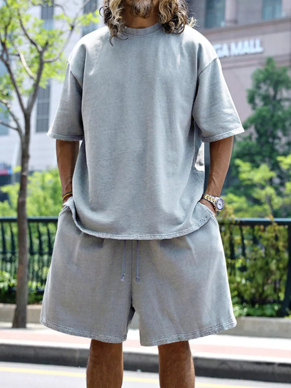 Men's light gray relaxed fit two-piece set with drawstring shorts and crew neck t-shirt.
