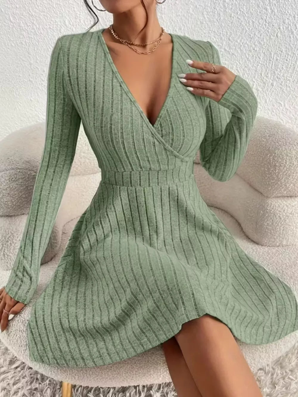 Sage ribbed wrap mini dress with V-neck and long sleeves.