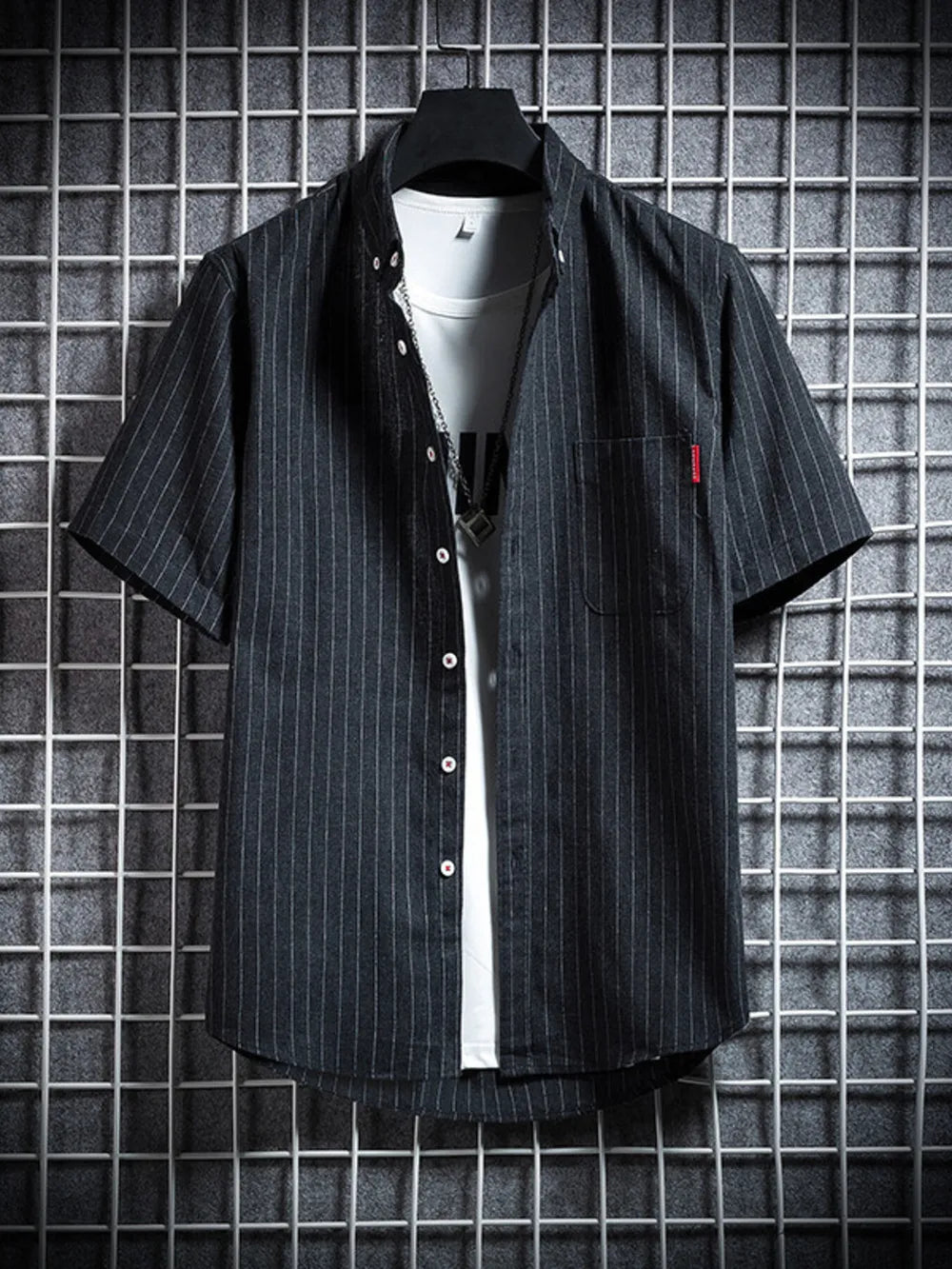 Men's black striped short sleeve button-up shirt with a pocket detail.