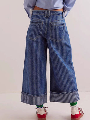 Dark blue striped high-waisted cropped jeans with cuffed hems.