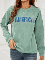 Corduroy sweatshirt in Gum Leaf with "America" graphic, crewneck, long sleeves.