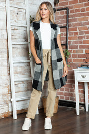 Geometric knit duster vest in black and gray checkered pattern with pockets and lapel.