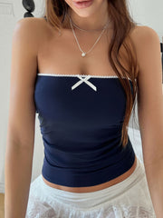 Navy bandeau top with white lace trim and a white bow detail.