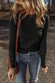 Black crewneck long sleeve knit top with subtle seam details on sleeves.