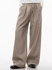 Khaki wide-leg pleated trousers with vertical pinstripes and drawstring waist.