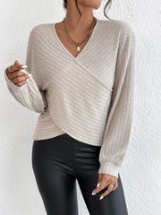 Dust Storm ribbed knit cross-front blouse with blouson sleeves and a V-neck.