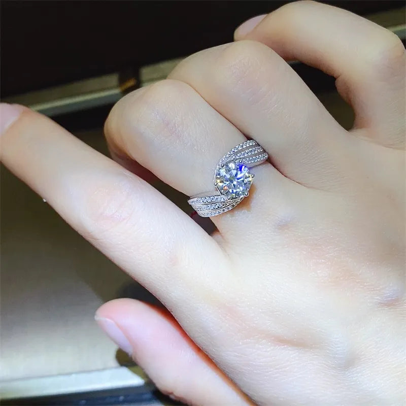 Silver swirl band ring with moissanite and pave details on hand