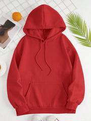 Oversized red hoodie with drawstring hood, pouch pocket, and ribbed cuffs and hem.