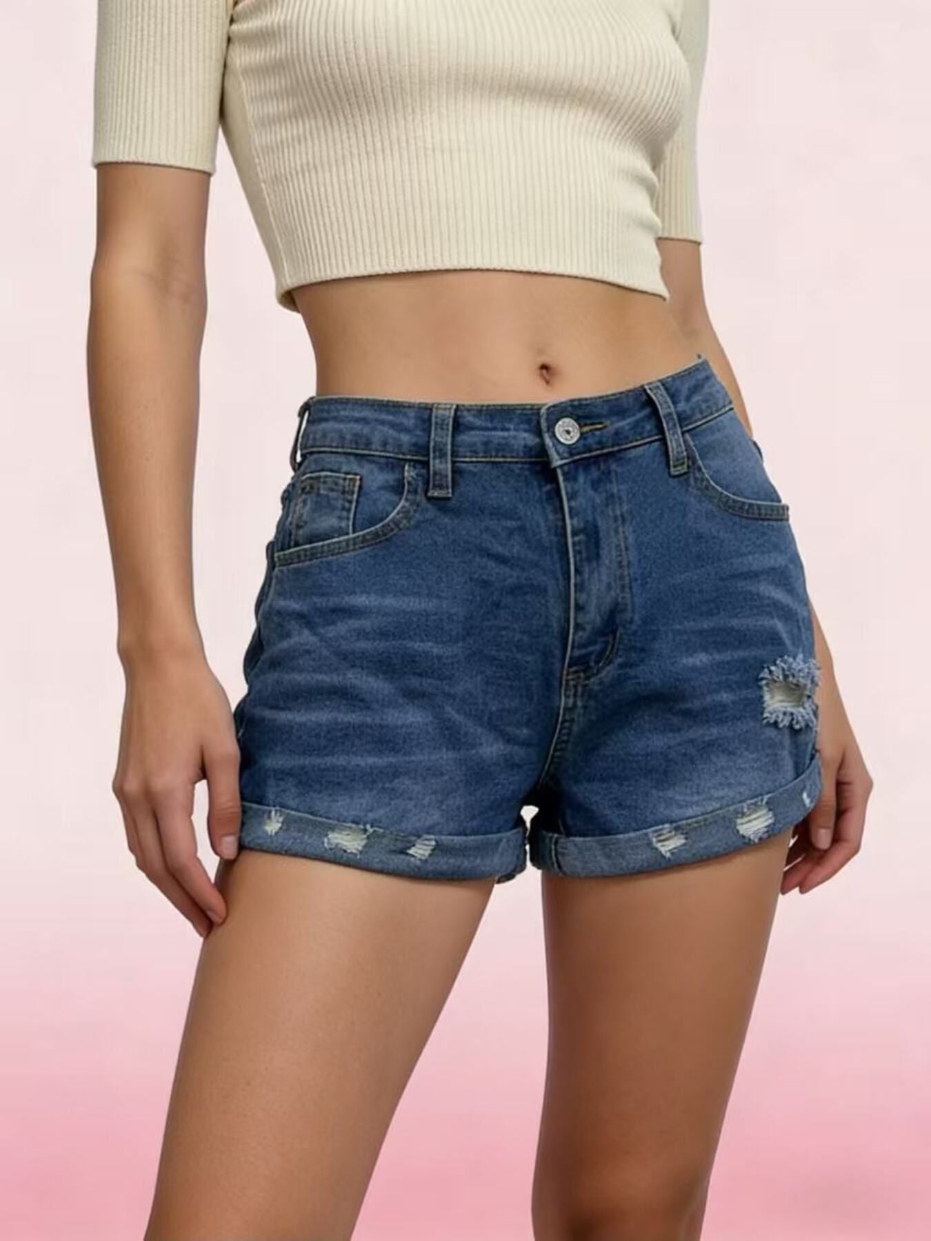 Dark blue distressed denim shorts with rolled cuffs and button fly