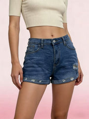 Dark blue distressed denim shorts with rolled cuffs and button fly