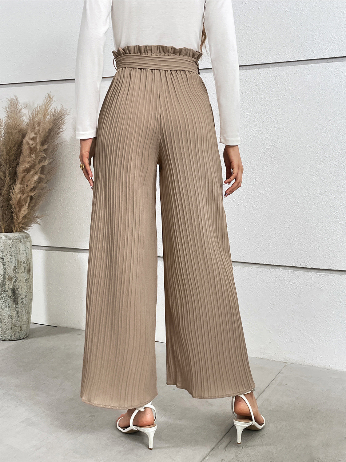 Camel pleated palazzo trousers with tie waist and ruffled detail