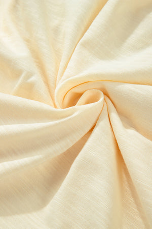 Pastel yellow embroidered poet sleeve blouse fabric detail
