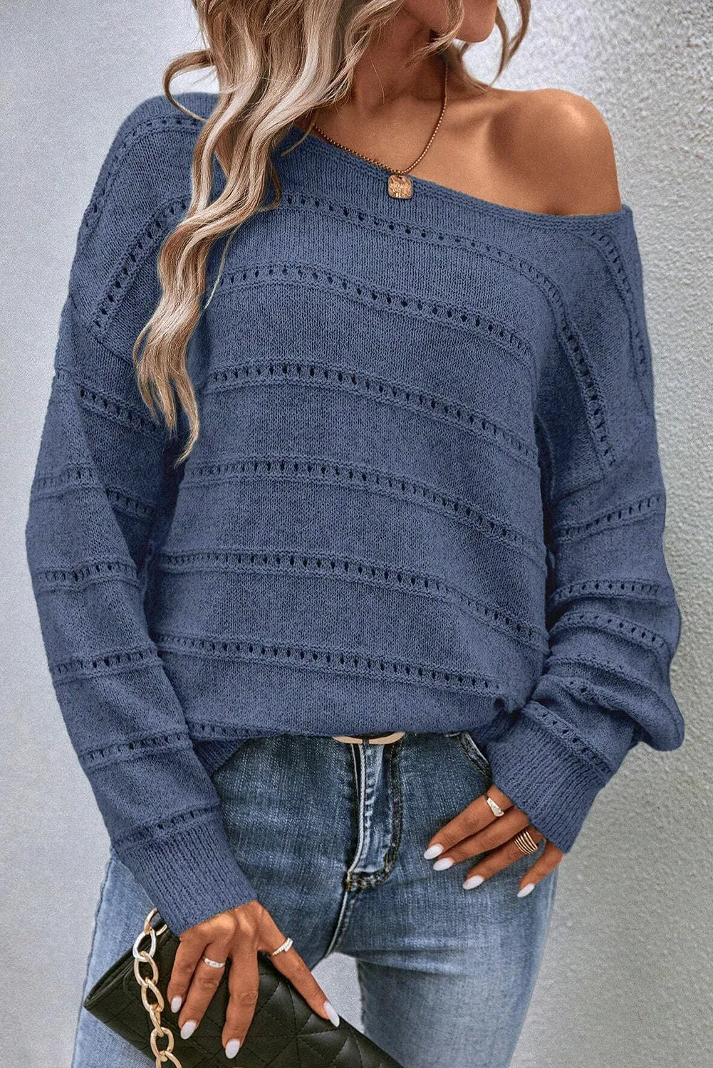 Off-the-shoulder French blue openwork knit pullover sweater with horizontal stripe detail.