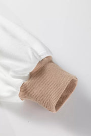 Chic colorblock sweatshirt with beige ribbed cuff and white sleeve detail.
