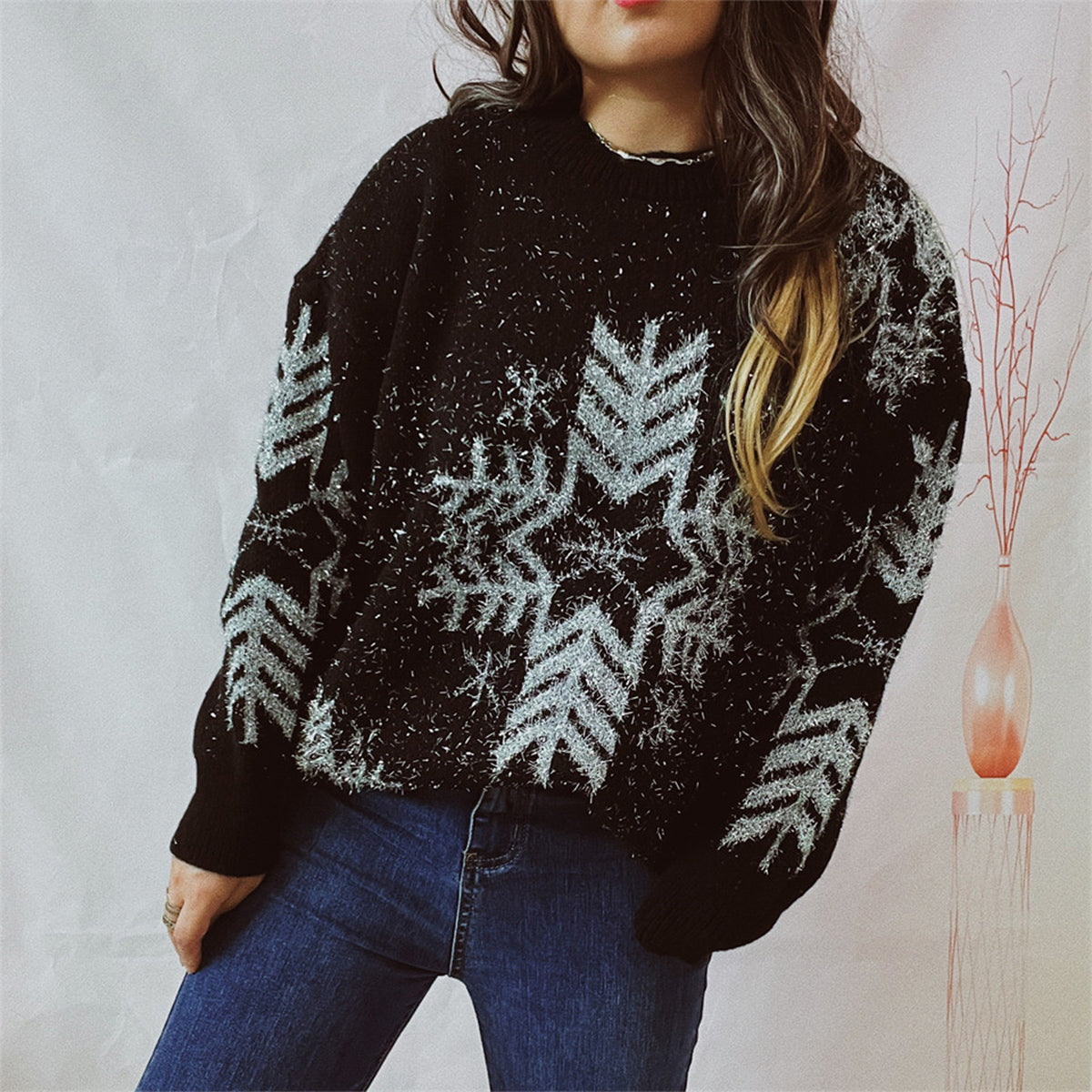 Black acrylic sweater with snowflake pattern and metallic threads