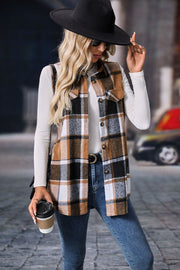 Plaid utility vest in camel, black, white, and brown with patch pockets and button front.