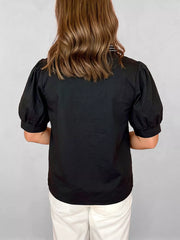 Black maternity overshirt with puff sleeves and cuffed hem.