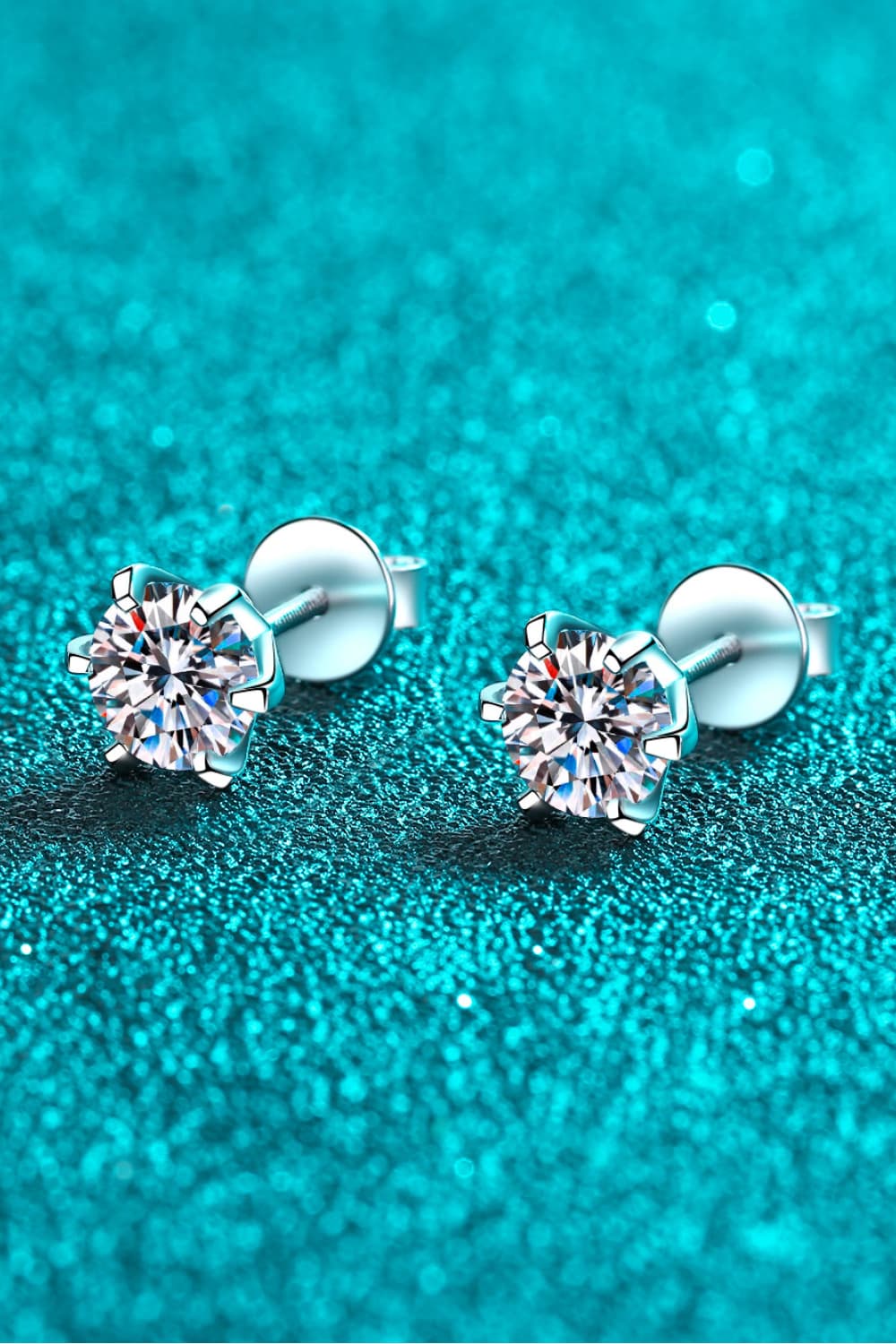 Silver six-prong solitaire stud earrings with clear cubic zirconia gems.