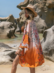 Ombre floral kimono cover-up in orange, 100% viscose, with wide sleeves and a boho print.