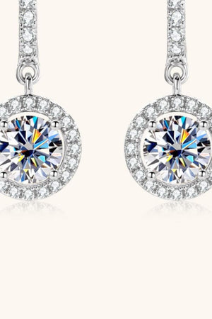 Silver pavé halo drop earrings with a large round center stone.