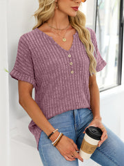 Ribbed knit short sleeve t-shirt in dusty blue with decorative buttons and a curved hem.