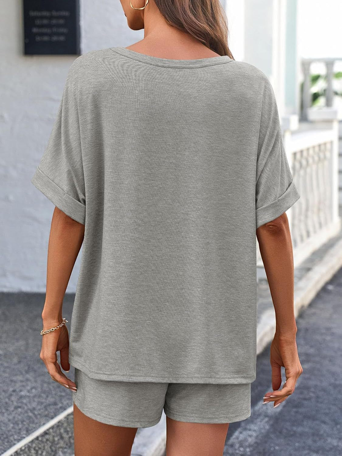 Gray relaxed fit tee with cuffed short sleeves and matching shorts.