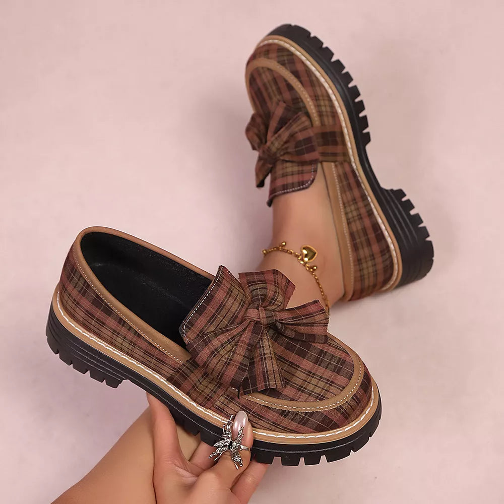Plaid chunky loafers in tan with bow accent and lug sole.