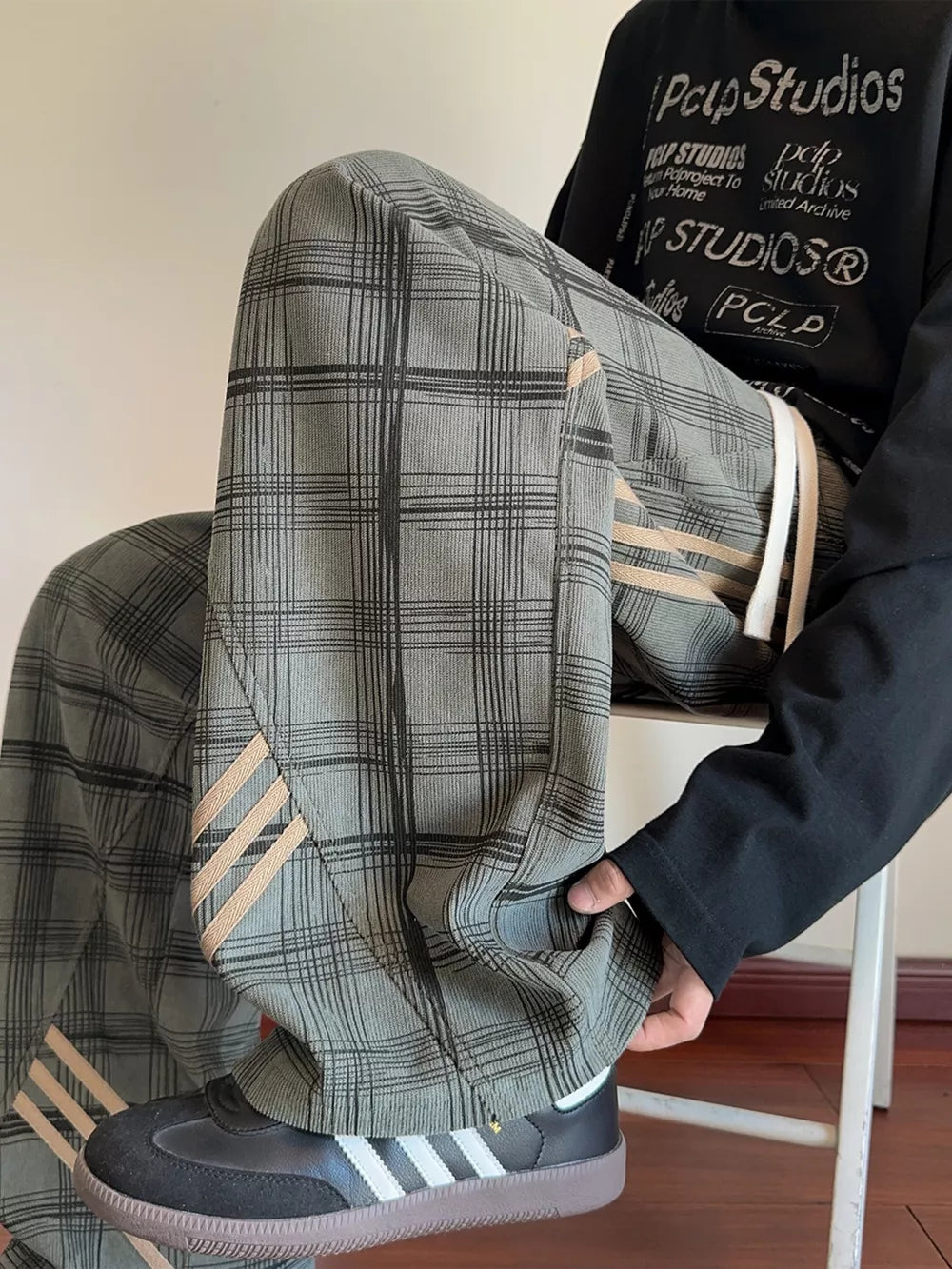 Men's Plaid Wide-leg Sweatpants With Side Stripes in Green, model styling view