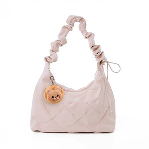 Blush pink ruched shoulder bag with a cute bear charm and quilted detail.