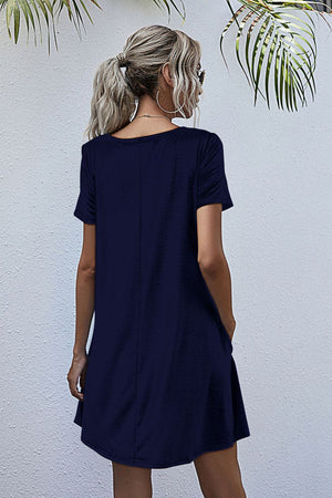 Dark blue relaxed pocketed tee dress with short sleeves and a scoop neckline.
