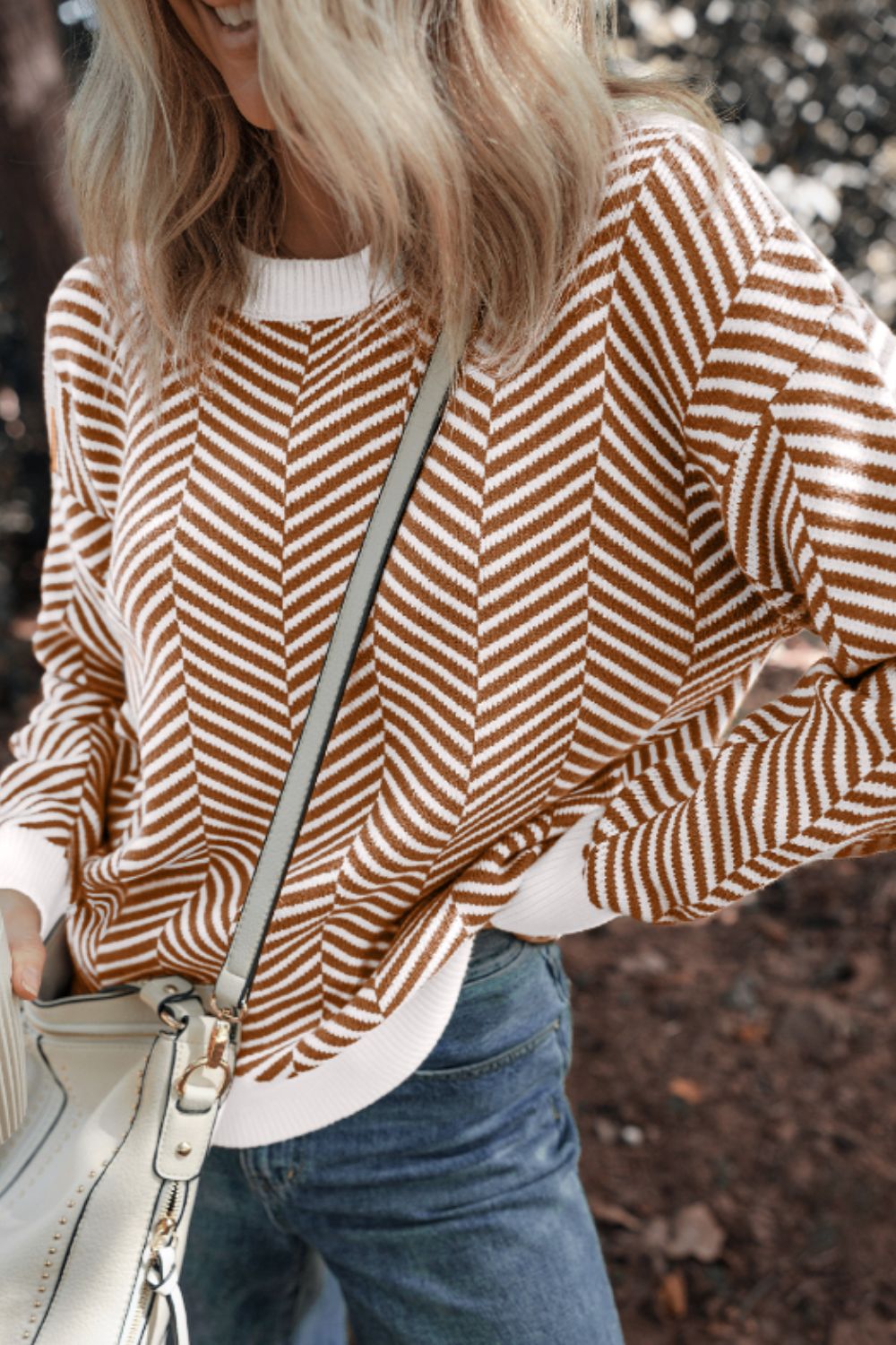 Chevron knit crewneck sweater in camel and white with a relaxed fit.