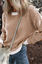 Chevron knit crewneck sweater in camel and white with a relaxed fit.