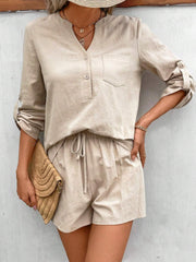 Tan linen henley shirt with rolled sleeves and drawstring shorts set.