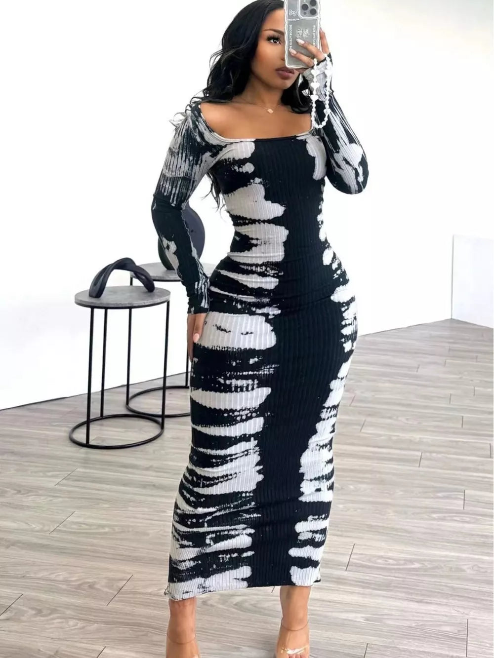 Black and white tie-dye maxi dress with long sleeves and a square neckline.