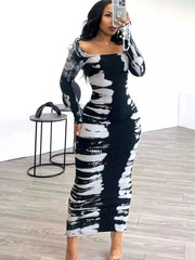 Black and white tie-dye maxi dress with long sleeves and a square neckline.