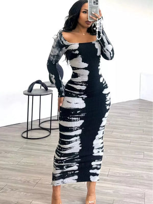 Black and white tie-dye maxi dress with long sleeves and a square neckline.