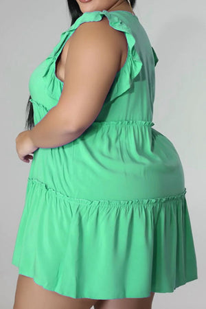 Mint green tiered ruffle babydoll mini dress with ruffled straps and hem.