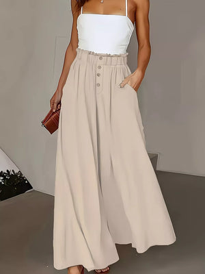 Beige wide-leg trousers with paperbag waist and button detail.