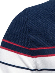 Navy and white striped knit crewneck sweater with red trim detail.